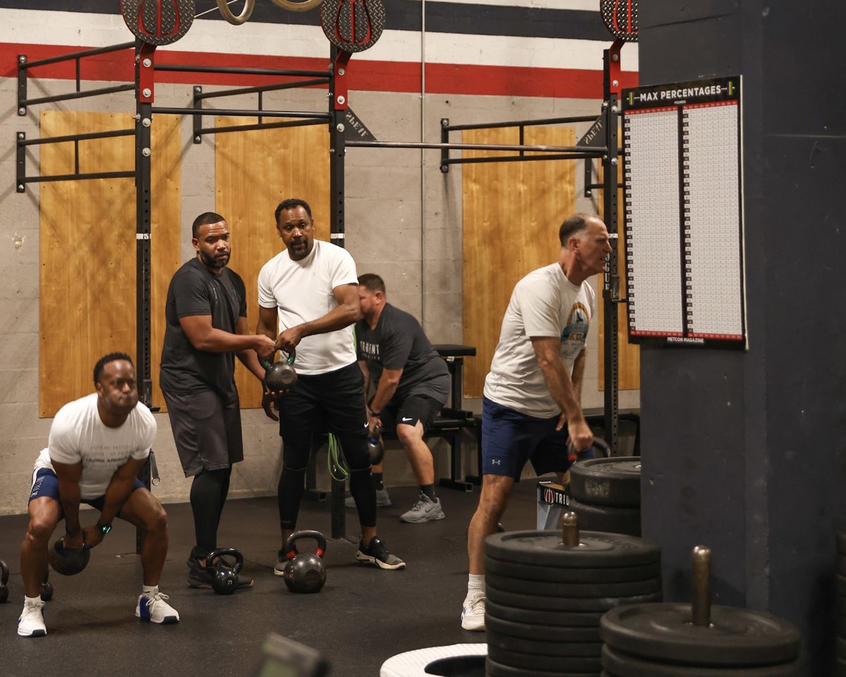 A group of men with kettlebells