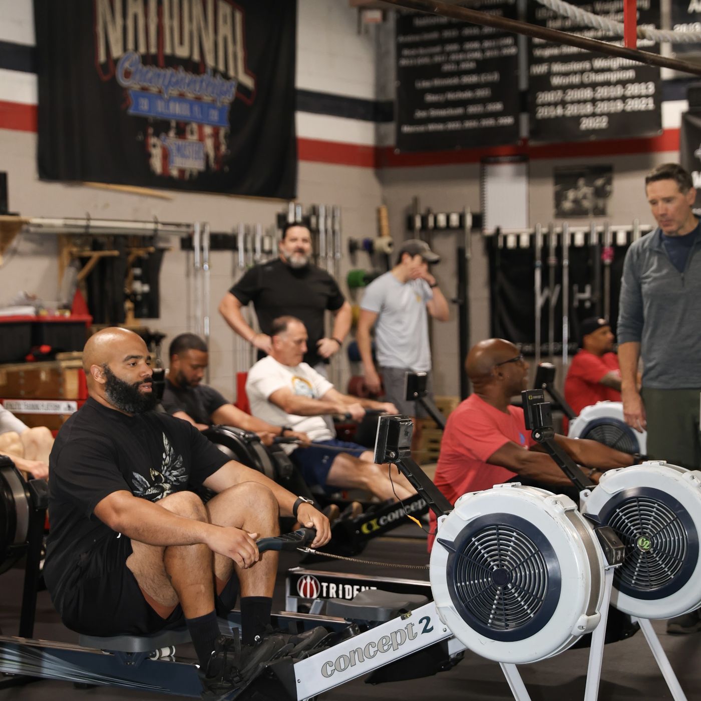 Men on rowers during the workout